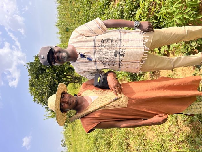 Adani Abdallah with a farmer during a field visit
